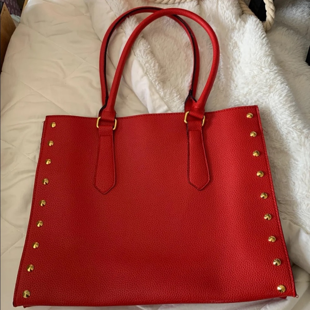 red tote with gold studs